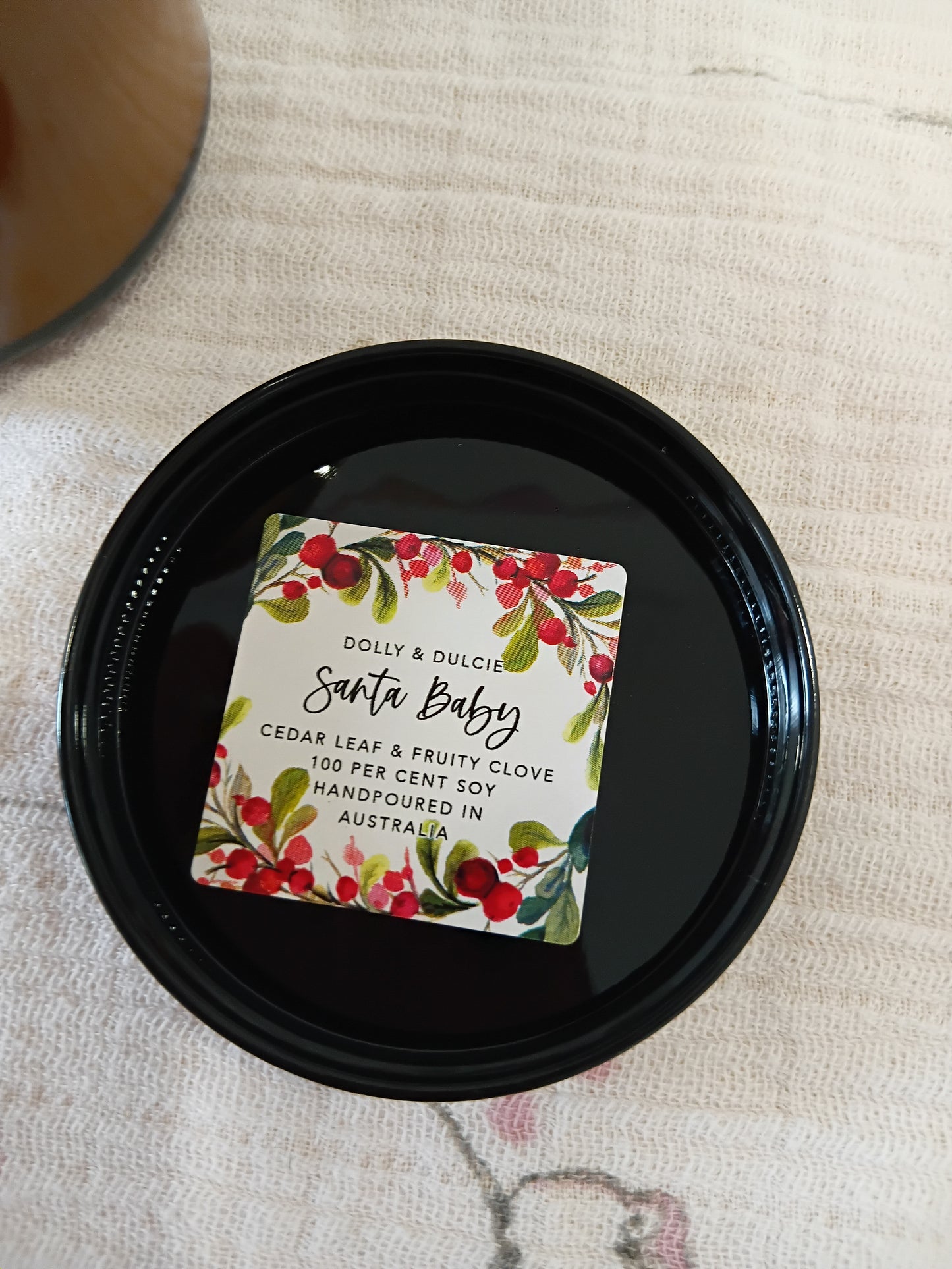 Santa Baby cedar leaf and fruity clove soy candle.