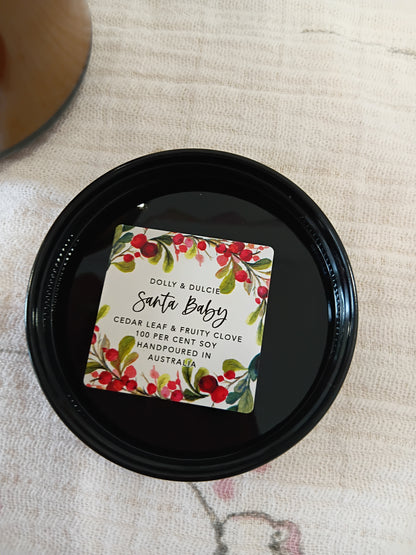Santa Baby cedar leaf and fruity clove soy candle.